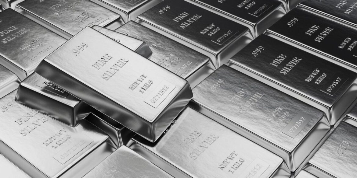 Stacks of shiny silver bars labeled fine silver and 999 purity.jpg