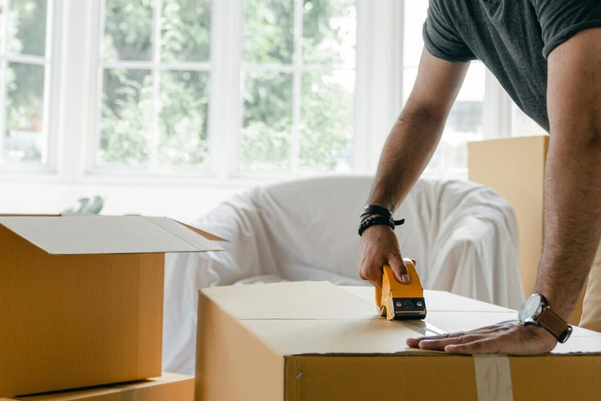 Person taping moving box.jpg