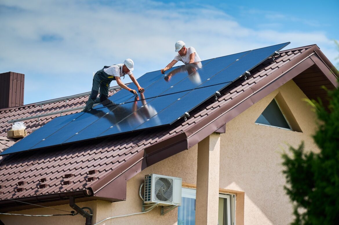 Solar panel installers on roof shutterstock 2515380993 anatoliy gleb scaled.jpg
