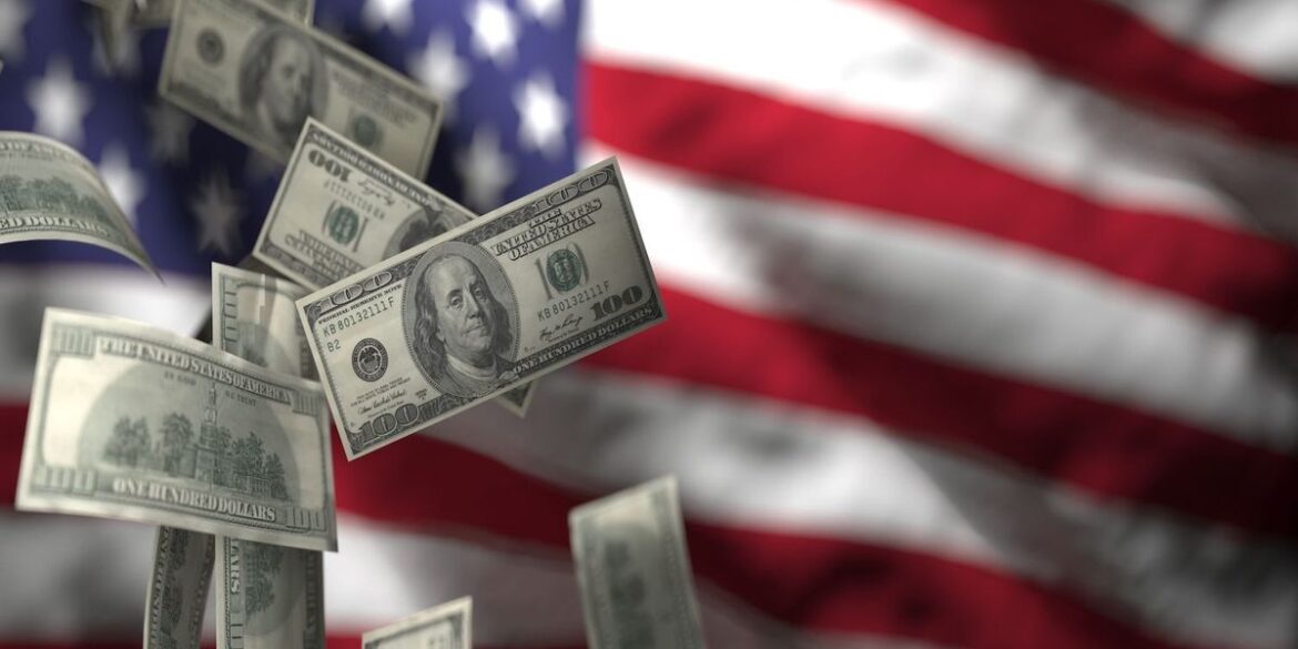Floating us 100 bills over a blurred american flag background.jpg