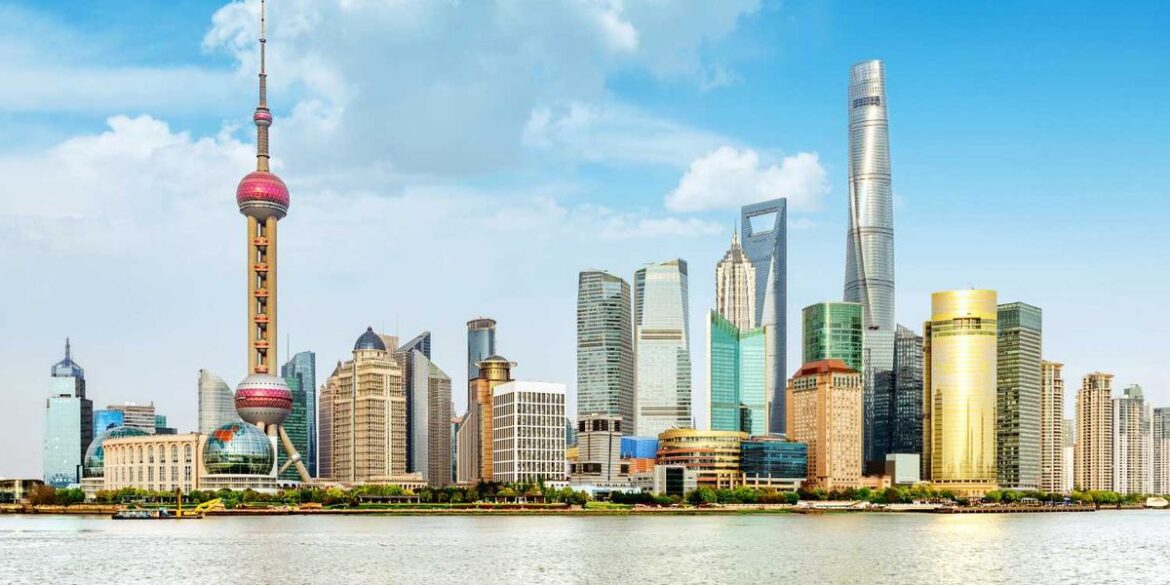 Shanghai skyline with modern skyscrapers and oriental pearl tower by the river.jpg