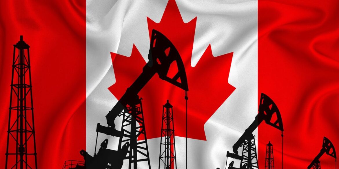 Silhouette of drilling rigs and oil derricks with canadian flag in background.jpg