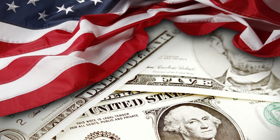 American flag draped over us bills.jpg
