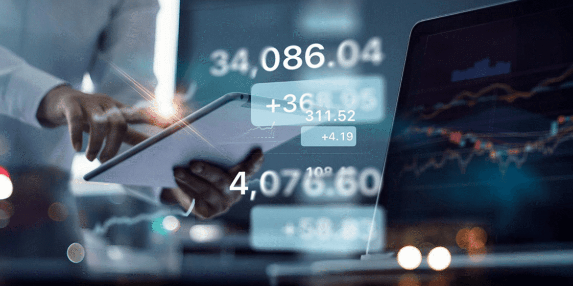 Person using tablet with financial charts and numbers on screen.png