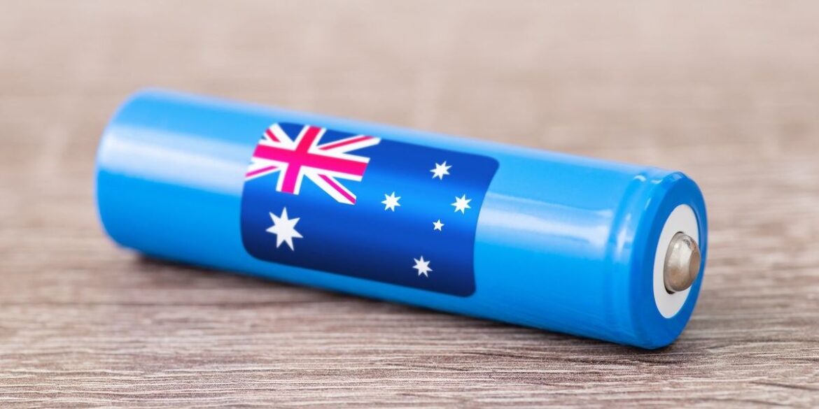Blue battery with australian flag design on a wooden surface.jpg