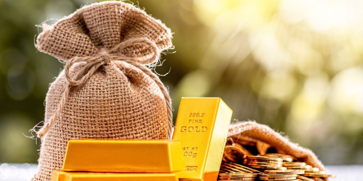 Gold bars and coins as well as a sac of gold.jpg