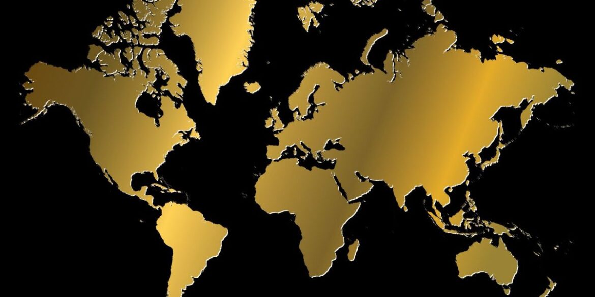 Gold map of the world over black background.jpg
