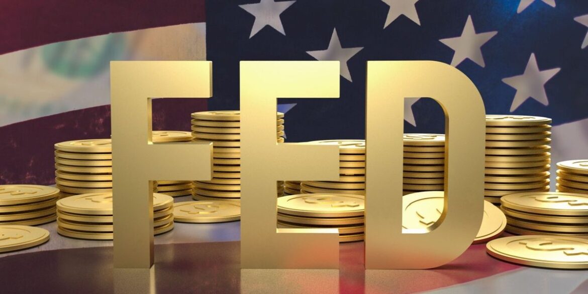 Gold letters spelling fed in front of a pile of gold dollar coins and us flag.jpg