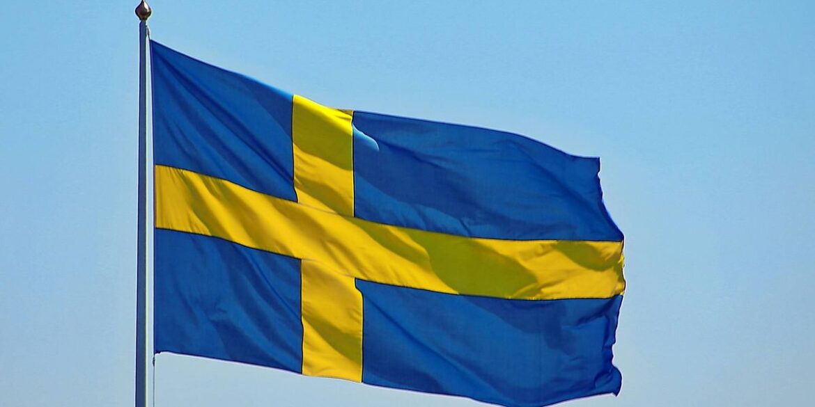 Swedish flag against clear sky.jpg