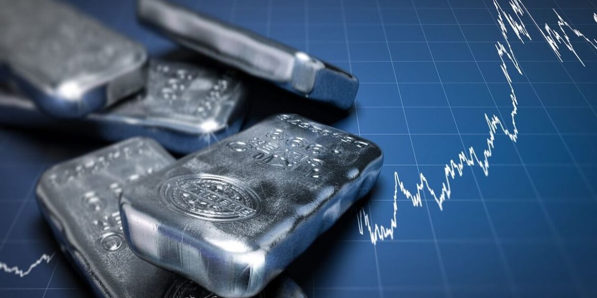 Silver bars on a rising stock market graph.jpg