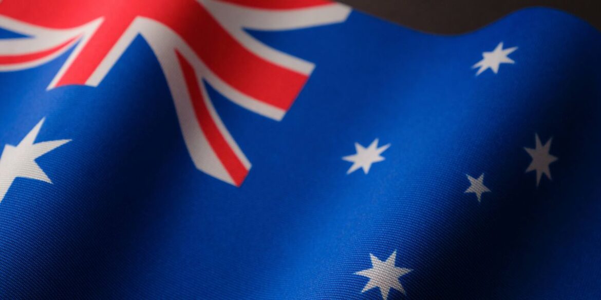 The australian flag with a blue background white stars and the union jack in the upper left corner.j.jpeg