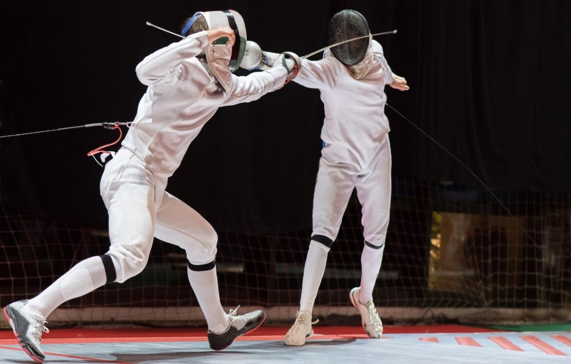 Two College Students Fencing Athletes.jpg