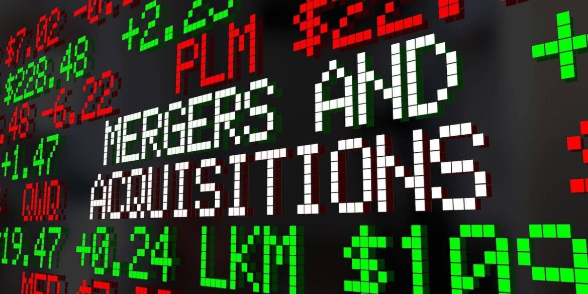 Stock market tickers with various numbers in red and green text reads mergers and acquisitions.jpg