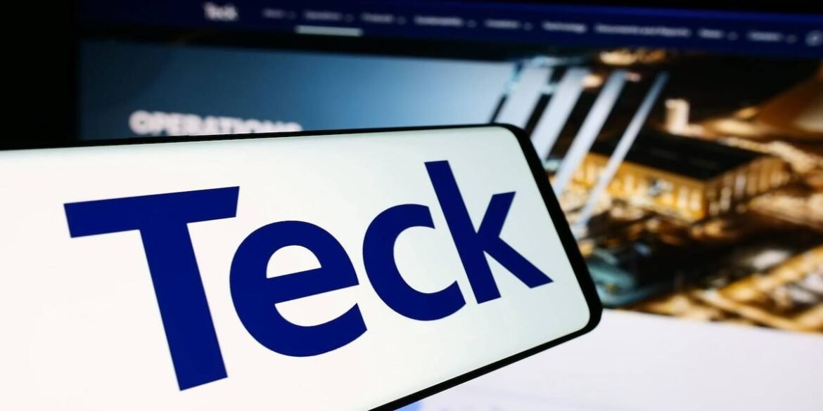 A white rectangle with blue text reads teck over a blurred industrial website background.jpg