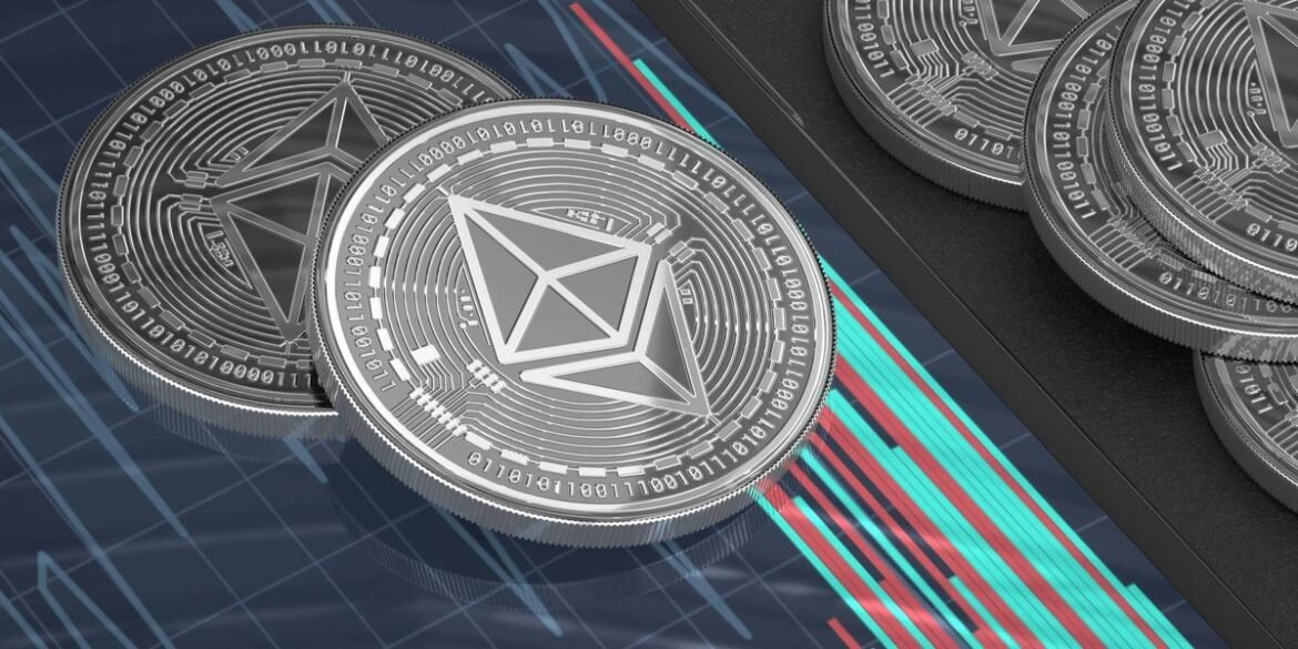 Silver cryptocurrency coins with geometric designs rest on tablet displaying digital chart with gree.jpeg